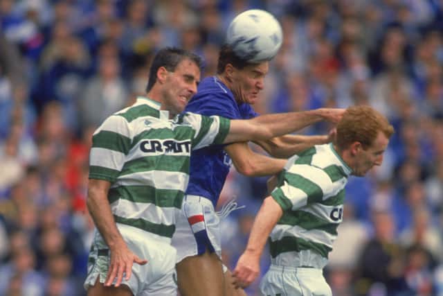 Richard Gough of Rangers competes for the ball with Mick McCarthy (left) and Tommy Burns of Celtic