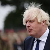 UK prime minister Boris Johnson meets with military personnel who worked on the Afghan evacuation during a visit to Merville Barracks on September 2