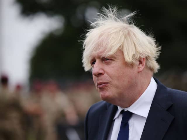 UK prime minister Boris Johnson meets with military personnel who worked on the Afghan evacuation during a visit to Merville Barracks on September 2