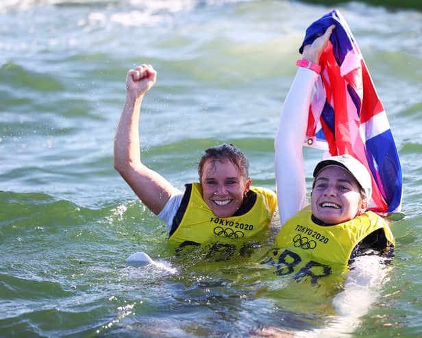 Hannah Mills (L) and Eilidh McIntyre of Team Great Britain celebrate following the Women's 470 class medal race on day twelve of the Tokyo 2020 Olympic Games (Photo by Clive Mason/Getty Images)