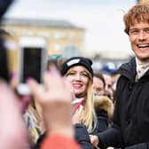 Sam Heughan meets fans who were waiting in St Andrew’s Square on March 14, 2018 in Glasgow,Scotland. (Photo by Jeff J Mitchell/Getty Images)