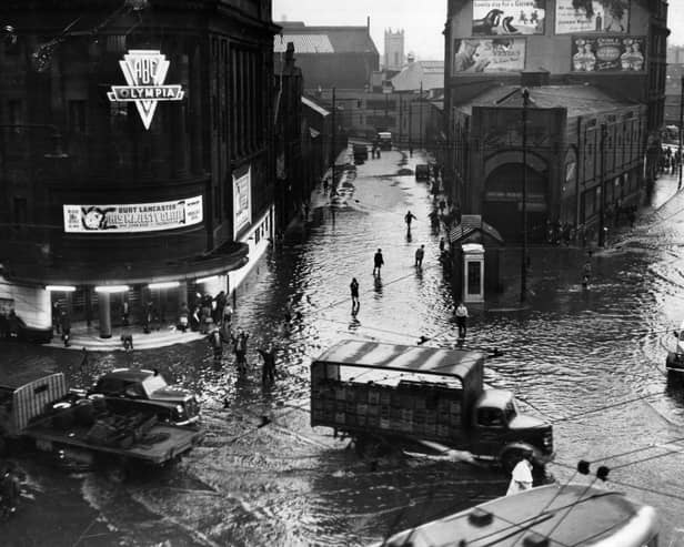 Bridgeton Cross, Glasgow, is inundated with floodwaters after torrential rains caused rivers to burst their banks. 