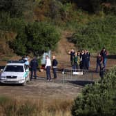 Portuguese Judicial Police criminal investigation unit members prepare at the base camp near the Arade dam, in Silves, on 24 May, 2023 on the second day of a new search operation amid the investigation into the disappearance of Madeleine McCann. (Photo by FILIPE AMORIM / AFP) (Photo by FILIPE AMORIM/AFP via Getty Images)