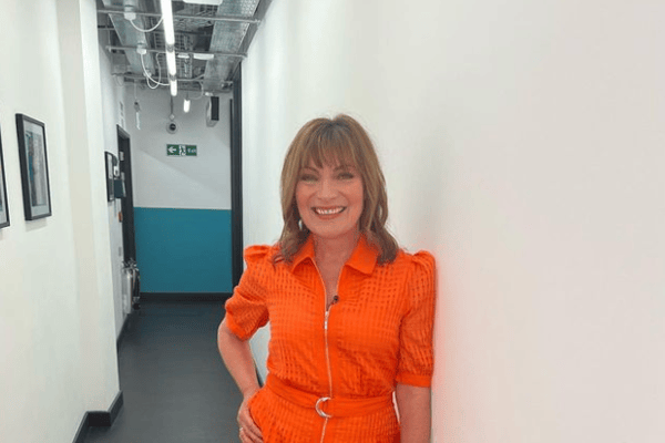 Lorraine matched with a fellow ITV star this week in a bright orange dress