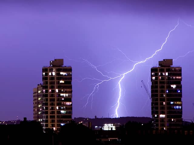 Lightning flashes in the night sky over south London. A weather warning is in place for thunderstorms today (Sunday, June 18) across England, Wales and Northern Ireland.