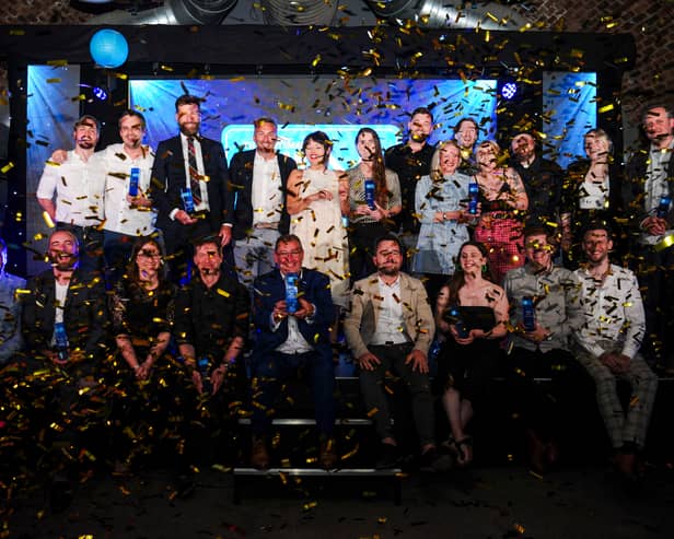 All the winners from the Scran food and drink awards pose for a picture on stage
