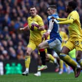 Ryan Kent of Rangers vies with Ryan Alebiosu of Kilmarnock in March