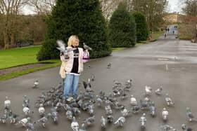 Holly MacDougall feeding the pigeons in Kelvingrove Park