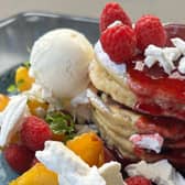 Peach Melba pancakes with vanilla ice cream at the Southside’s best cafe. 
