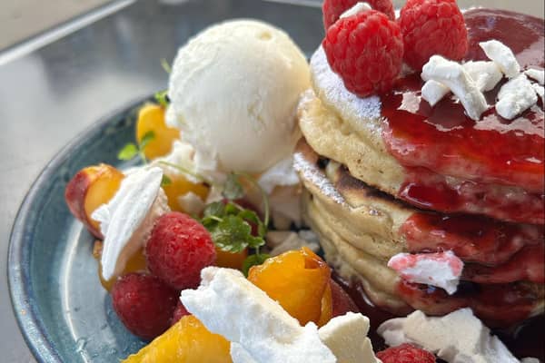 Peach Melba pancakes with vanilla ice cream at the Southside’s best cafe. 
