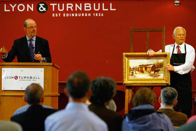 ‘Chopping logs outside a snow covered cabin’ during the auction at Lyon & Turnbull in Edinburgh - it was bought at the Barras for 50p and sold for £34,000