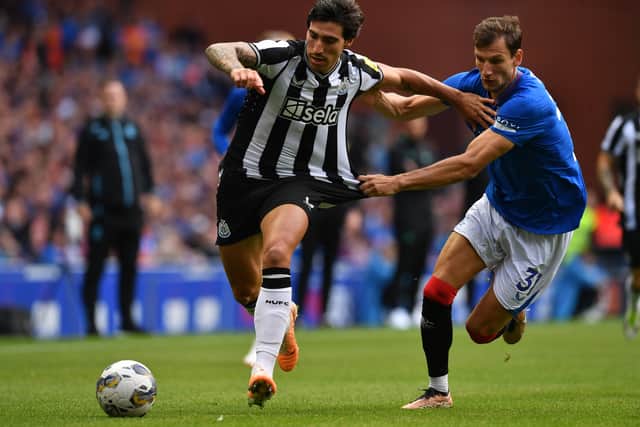 Sandro Tonali of Newcastle United battles with Borna Barisic of Rangers