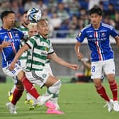 Celtic's forward Daizen Maeda (C) fights for the ball against players of Japan's Yokohama F Marinos