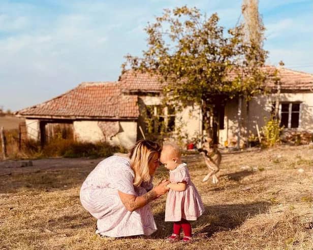 Jordan and Fae Vye outside their farmhouse in Bulgaria.