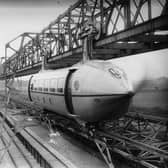 The Railplane in action, driven and stopped by two massive propellers on either end of the carriage