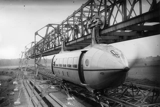 The Railplane in action, driven and stopped by two massive propellers on either end of the carriage