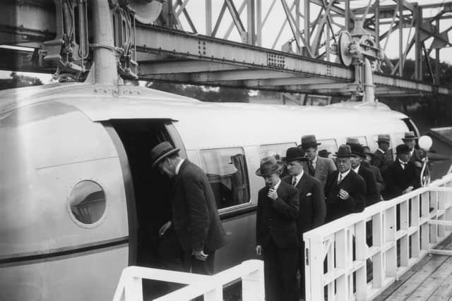 This photo from July 4, 1930 shows the first load of passengers queuing for the Bennie Railplane - once heralded as the future of transport in Glasgow; with inventor George Bennie third in the queue.
