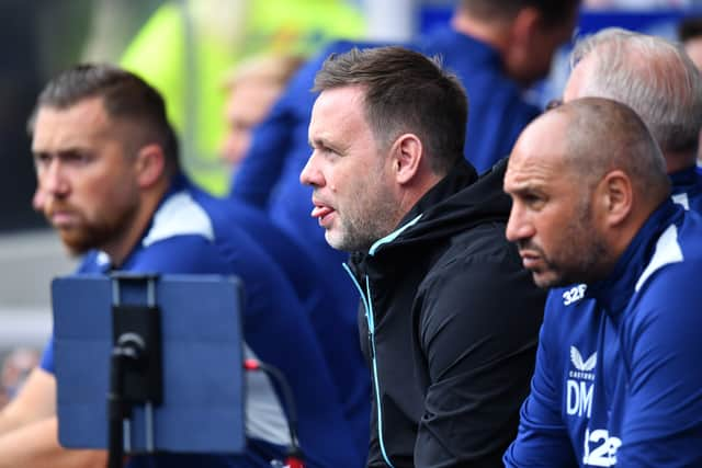 Michael Beale, manager of Rangers watches on from the Ibrox dugout