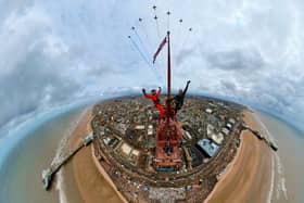 Two thrill-seekers have taken the ultimate selfie with the red arrows