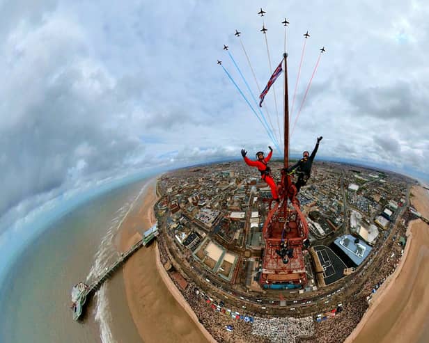 Two thrill-seekers have taken the ultimate selfie with the red arrows