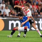 Malik Tillman of Glasgow Rangers is tackled by Guus Til of PSV Eindhoven  last season