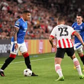 James Tavernier of Glasgow Rangers challenges Joey Veerman of PSV Eindhoven 