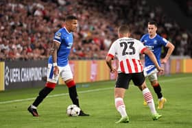 James Tavernier of Glasgow Rangers challenges Joey Veerman of PSV Eindhoven 