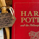 One of the rarest Harry Potter books ever published is set to fetch thousands of pounds at auction - after it survived being destroyed in a devastating flat fire. 