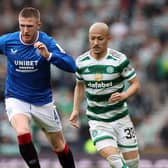 John Lundstram of Rangers evades Daizen Maeda of Celtic