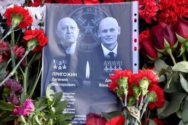 Sheet of paper with portraits of Yevgeny Prigozhin and Dmitry Utkin, a shadowy figure who managed Wagner’s operations and allegedly served in Russian military intelligence, is placed at a makeshift memorial in front of the Private Military Company (PMC) Wagner Centre in Saint Petersburg, on August 26.