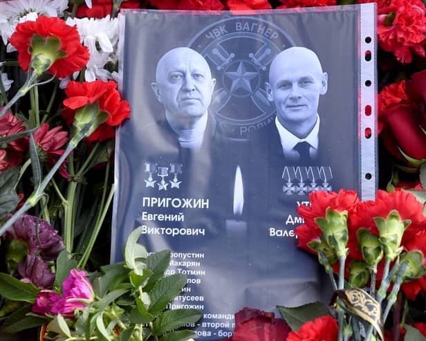 Sheet of paper with portraits of Yevgeny Prigozhin and Dmitry Utkin, a shadowy figure who managed Wagner’s operations and allegedly served in Russian military intelligence, is placed at a makeshift memorial in front of the Private Military Company (PMC) Wagner Centre in Saint Petersburg, on August 26.