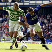  Henrik Larsson of Celtic is tackled by Lorenzo Amoruso of Rangers during the Bank of Scotland Scottish Premier League match between Glasgow Rangers and Glasgow Celtic held on April 27, 2003 at the Ibrox Stadium