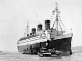 The RMS Queen Mary was constructed for Cunard-White Star Line by shipbuilding firm John Brown at Clydebank. Her maiden voyage was in May of 1936, and in August of that year she would go on to win the Blue Riband — an accolade for transatlantic passenger liners with the highest average speeds.

The Queen Mary features some of the grandest interior designs ever seen aboard an ocean liner. Influenced by the Art Deco movement of the 1920s and 30s, the distinctive design includes strong curves and geometric forms.

With the onset of World War II resulting in the ship’s conversion to troopship for Allied soldiers. Following the war, the Queen Mary once again began shuttling passengers back-and-forth across the Atlantic ocean.

The late 1950s saw the arrival of the jet age, resulting in the decrease of demand for sea travel and inevitably leading to the retirement of the Queen Mary in the late 1960s. During her service, the Queen Mary transported over 2 million passengers, and approximately 810,000 members of the military during World War II.

The Queen Mary was purchased by the City of Long Beach in 1967, who then worked to transform the vessel into a hotel, museum and event space.

The ship has hosted a dazzling array of famous faces over the decades, including Elizabeth Taylor, Clark Gable, Bob Hope, Bing Crosby, The Queen Mother, Winston Churchill, Audrey Hepburn and Greta Garbo.  