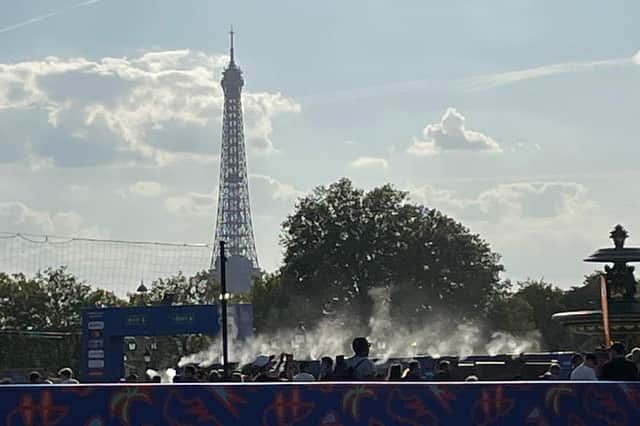 The Eiffel Tower looms over the the Rugby World Cup fan zone in Paris
