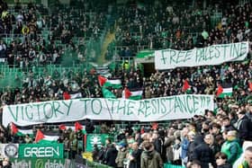 The Green Brigade hold up a banner in support for Palestine during Saturday’s Premiership match against Kilmarnock.