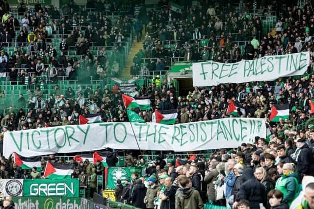 The Green Brigade hold up a banner in support for Palestine during Saturday’s Premiership match against Kilmarnock.