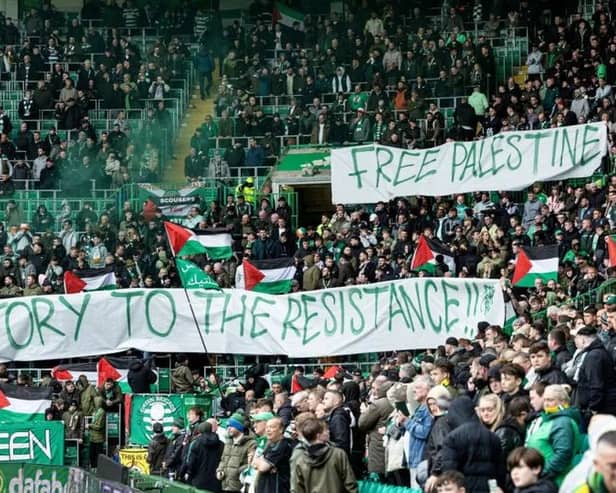 The Green Brigade hold up a banner in support for Palestine during Saturday’s Premiership match against Kilmarnock.