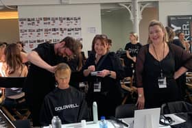 The team from ROAR Glasgow dressing a model’s hair backstage at Paris Fashion Week