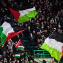 Celtic supporters hold Palestinian flags