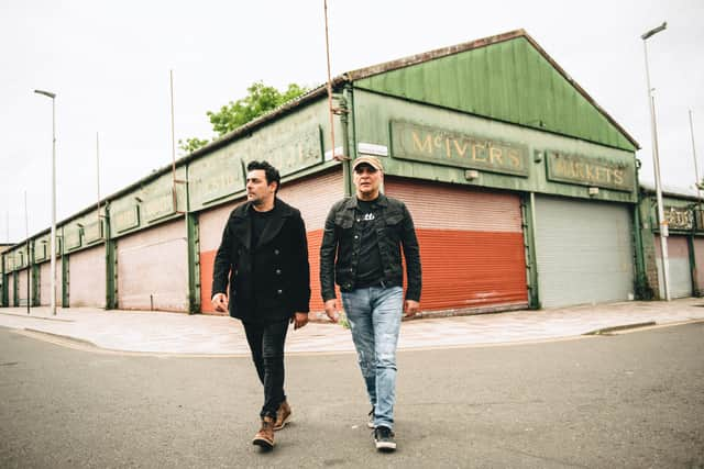 Dante and Jools of Gun walking through the Barras - they will play a live set at the RESONATE music industry show later this month.