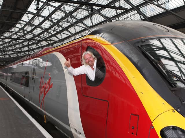 Sir Richard Branson promotes Virgin Trains at Liverpool Lime Street Station. Image: Tony Woolliscroft/Getty Images