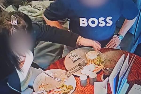 A pub customer has been caught on CCTV placing their own hair into their food in an attempt to get a refund for their meal. (Credit: Tom Croft / SWNS)