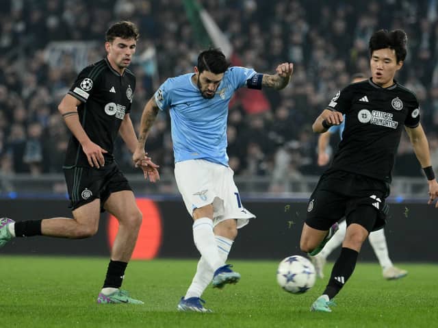 Luis Alberto of SS Lazio shoots under pressure from Celtic duo Matt O'Riley and Yan Hyun-jun.