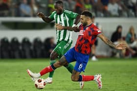 Rangers defender Connor Goldson fights for the ball with Aris Limassol forward Yannick Gomis in Cyprus