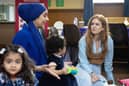 Isla Fisher speaks to Mary (mum) and meets children Roma and Dina at Home-Start Glasgow North and North Lanarkshire.