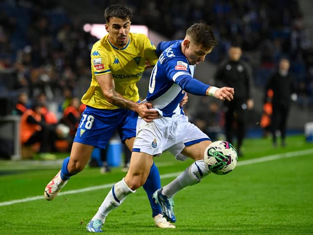 Estoril forward Tiago Araujo fights for the ball with FC Porto's Francisco Conceicao