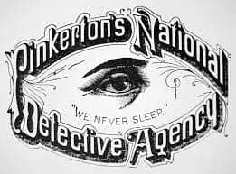 The original Pinkerton logo, their motto 'We Never Sleep' spoke of their doggedness in pursuit of their targets.