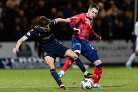 Dundee's Owen Beck (L) and Rangers' Scott Wright in action