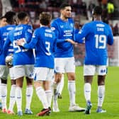 Abdallah Sima (R) is congratulated by his Rangers team mates after scoring against Hearts at Tynecastle.