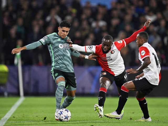 Celtic's Luis Palma (L) vies with  Feyenoord's Lutsharel Geertruida (C)